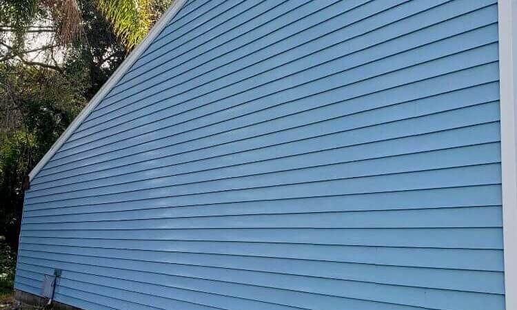 Blue siding after being pressure washed