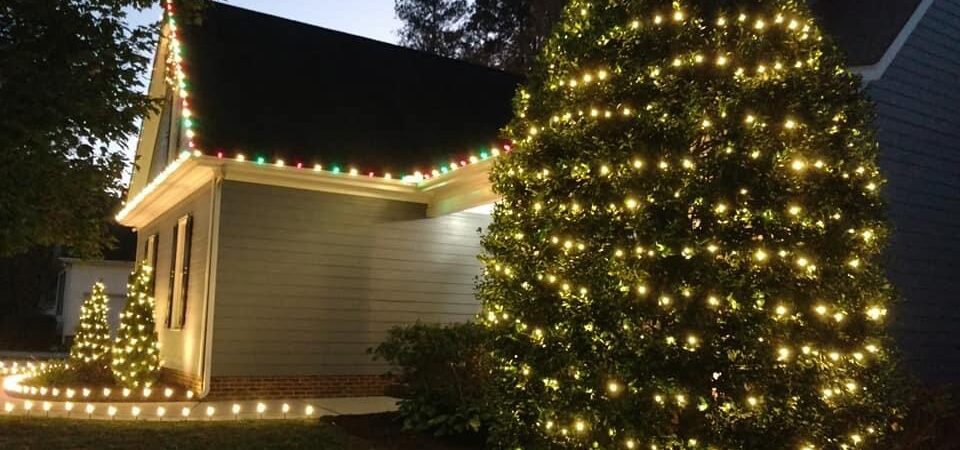 Holiday lights on house and tree