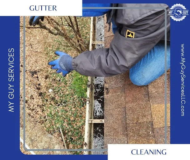 Technician cleaning gutters