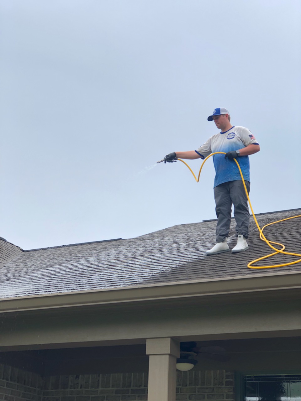 Before and after pressure washing a Plainfield roof