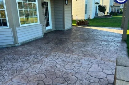 Freshly cleaned and sealed concrete driveway in an Avon subdivision