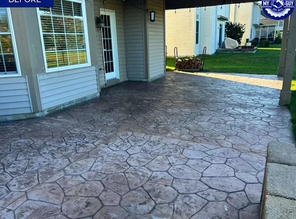 Freshly cleaned and sealed concrete driveway in an Avon subdivision